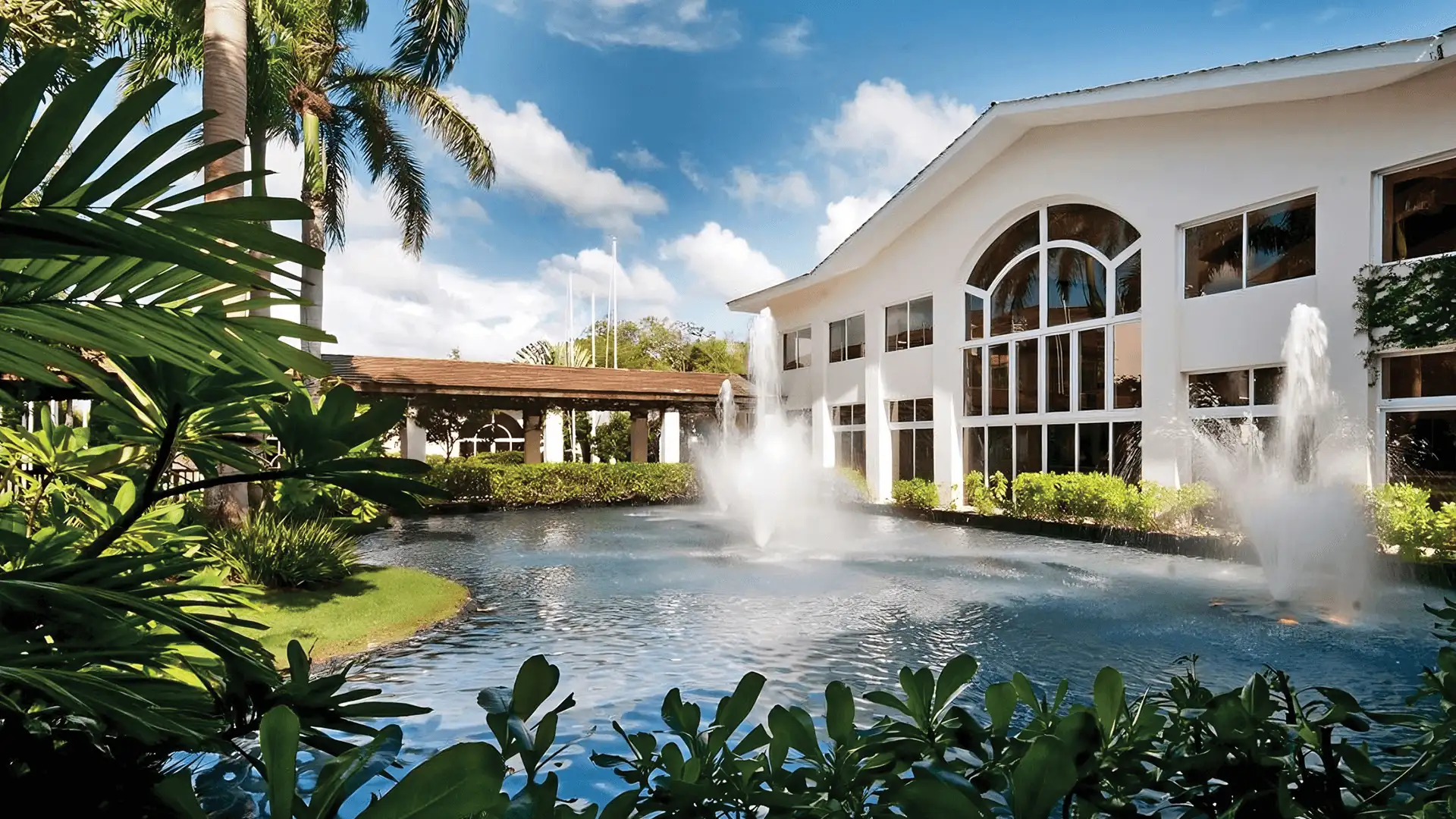 Cap Cana Heritage School building with fountains and tropical gardens