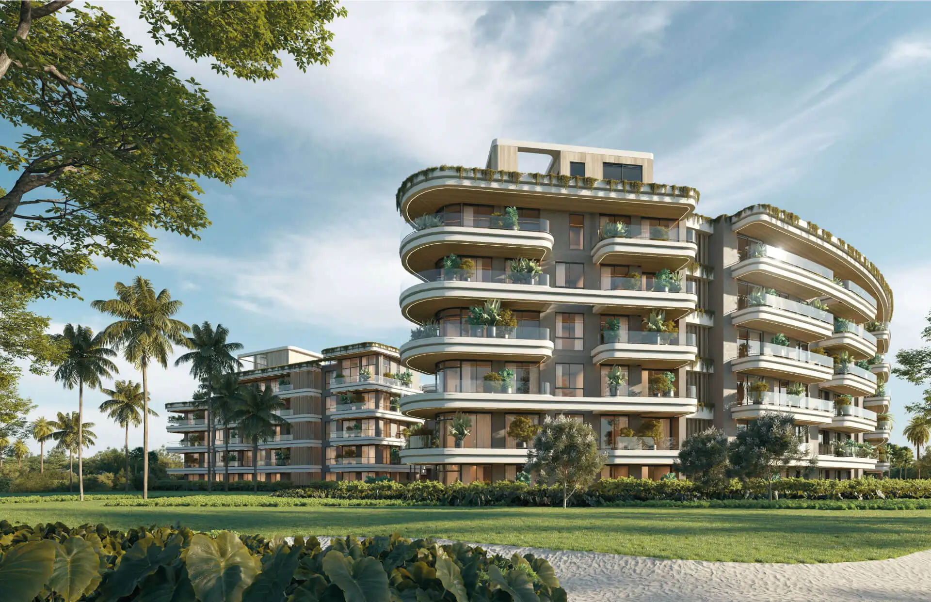 ELITE Cap Cana residential building with curved balconies surrounded by tropical gardens