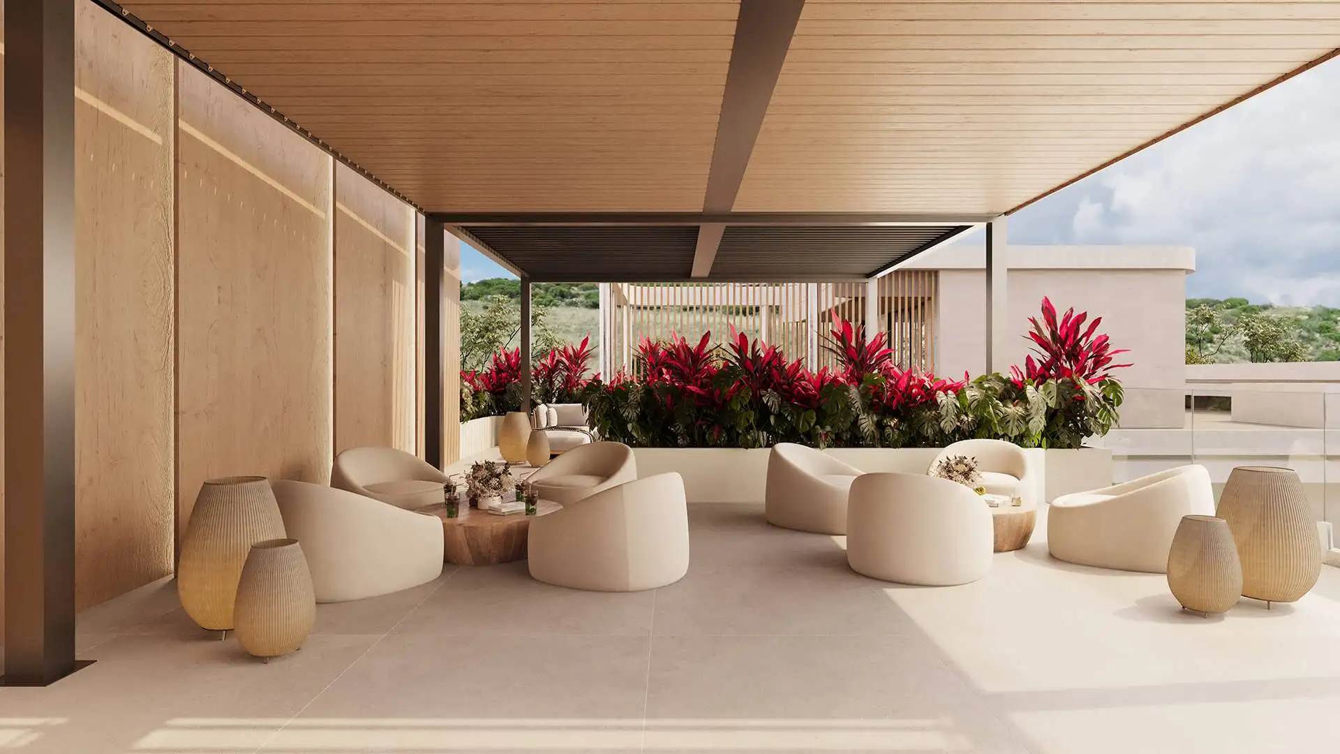 Covered terrace lounge with armchairs and tropical flowers, ELITE Cap Cana