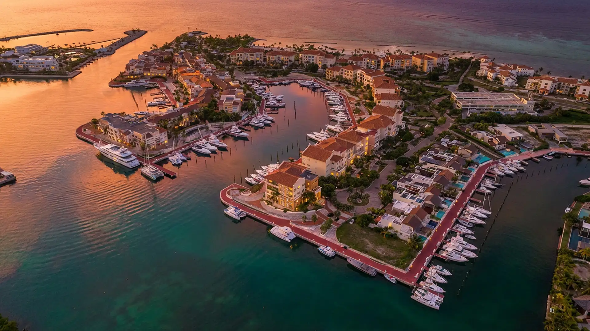 Aerial view of the Marina at Cap Cana at sunset with docked yachts